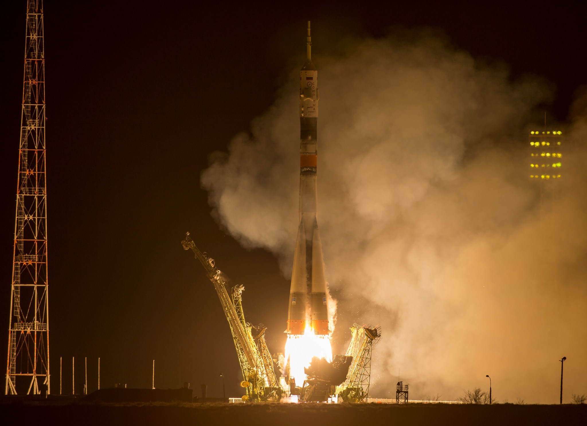 Fiery nighttime launch of Soyuz rocket from Baikonur