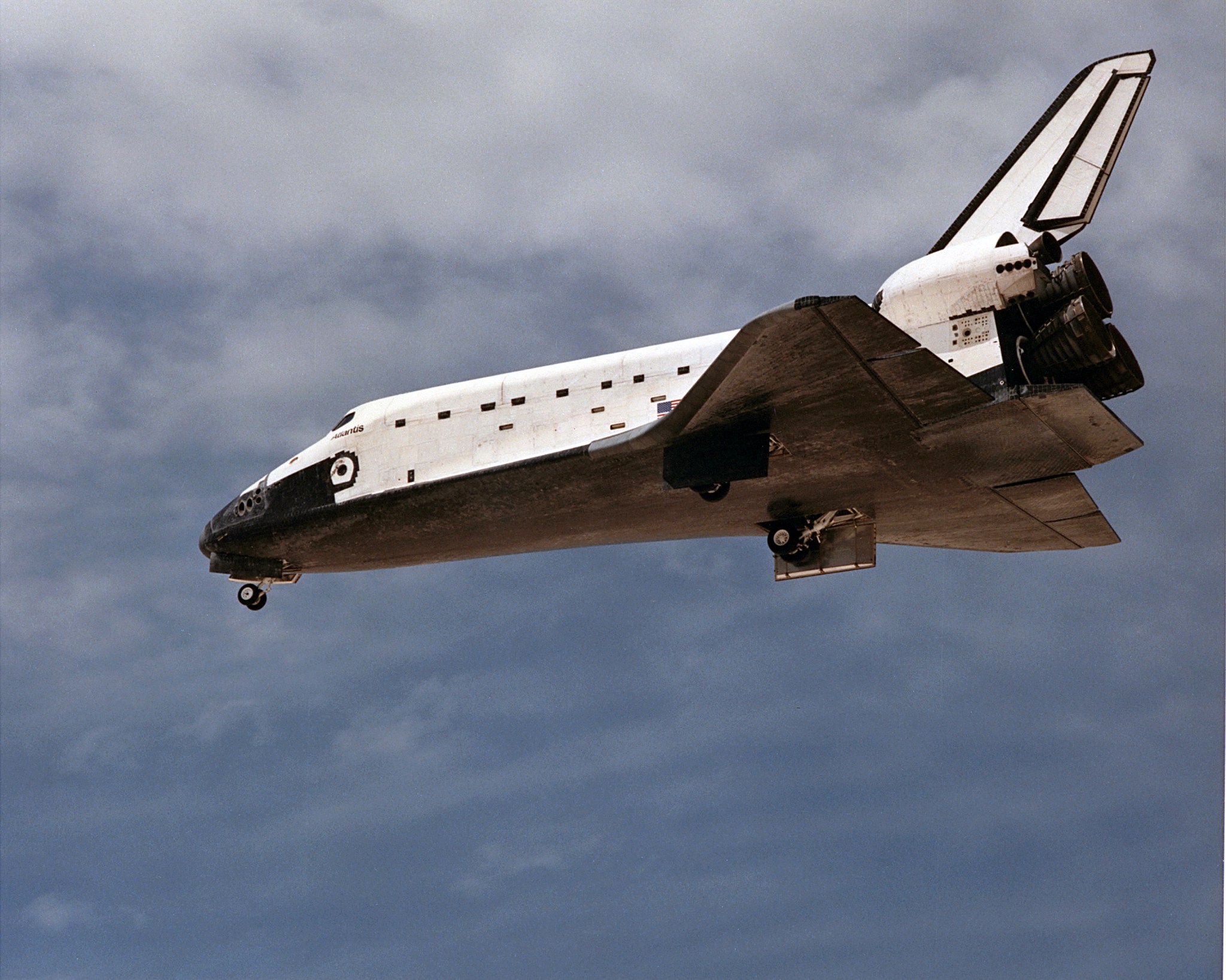Shuttle Atlantis flying through Earth's atmosphere on way to landing