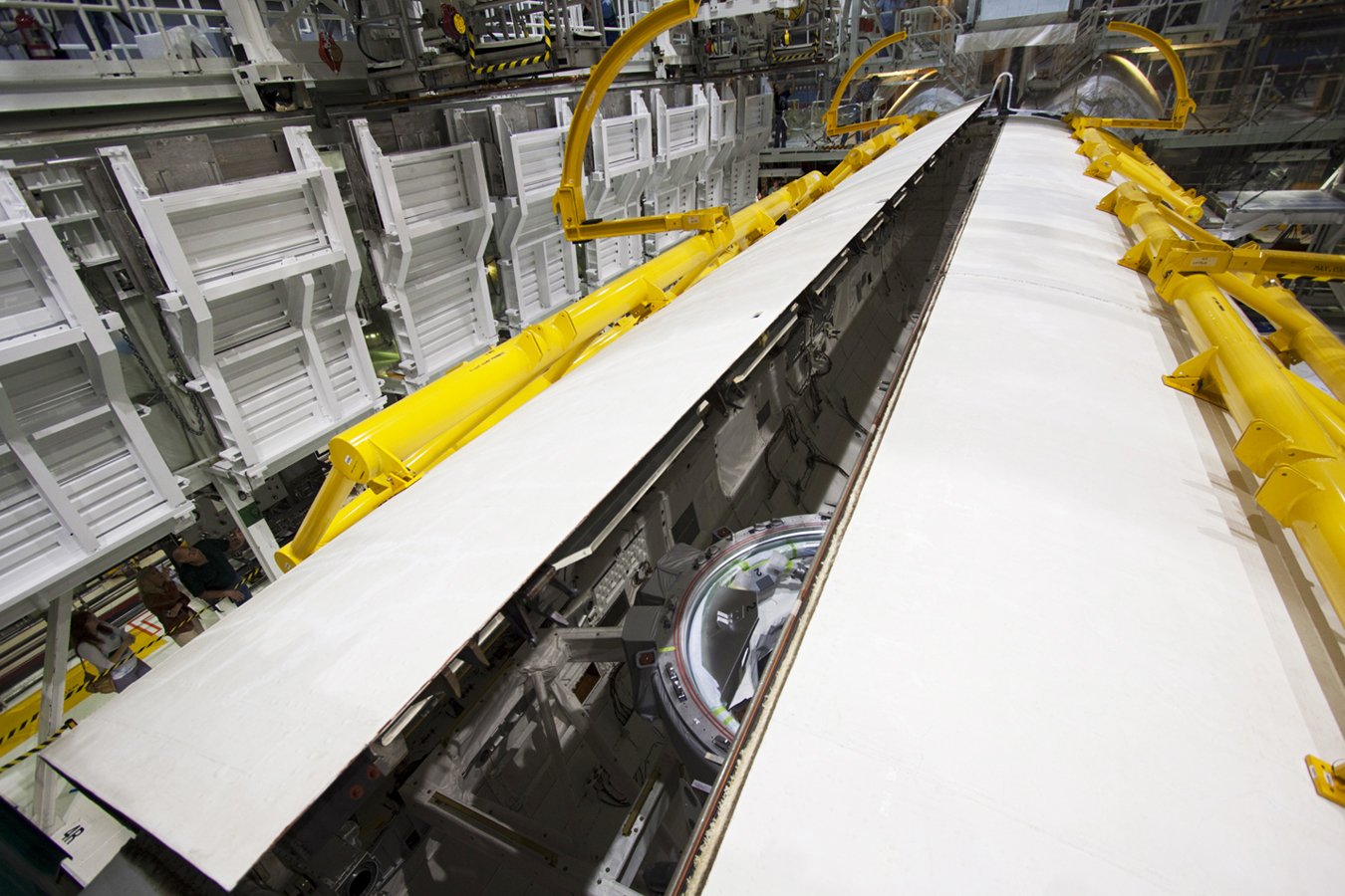 The right payload bay door closes on space shuttle Atlantis. 