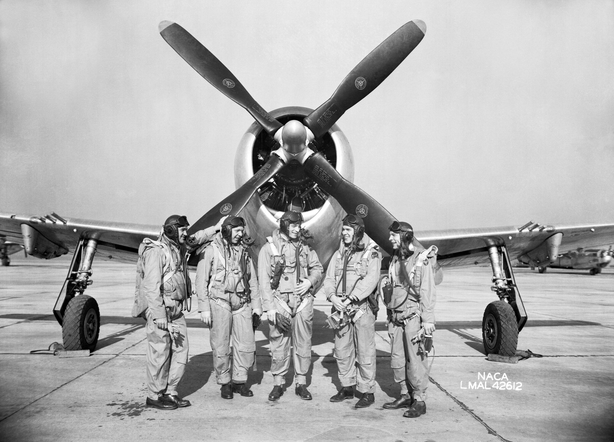 Langley research pilots in front of P-47 fighter