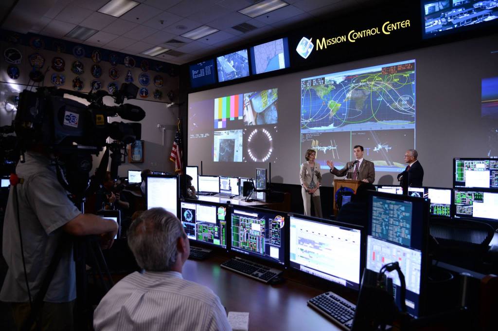 Mission Operations Director Paul Hill talks to the media as NASA Administrator Charles Bolden and Johnson Space Center Director