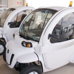 A photograph of low-speed electric vehicles at Kennedy Space Center.