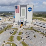 An aerial view of teams bringing the Space Launch System core stage into the Vehicle Assembly Building at Kennedy Space Center.