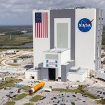 In this aerial view, teams are moving the Space Launch System core stage into the Vehicle Assembly Building at Kennedy Space Center following its arrival.