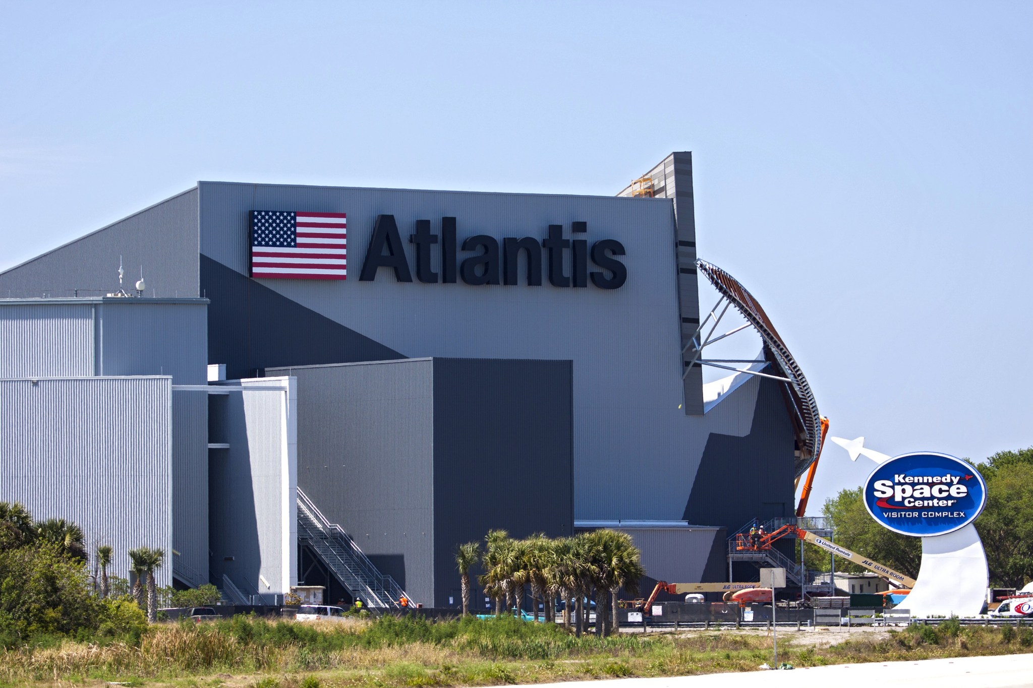 The Kennedy Space Center Visitor Complex has added the name "Atlantis" and American flag to the exterior of the "Space Shuttle Atlantis" exhibit.
