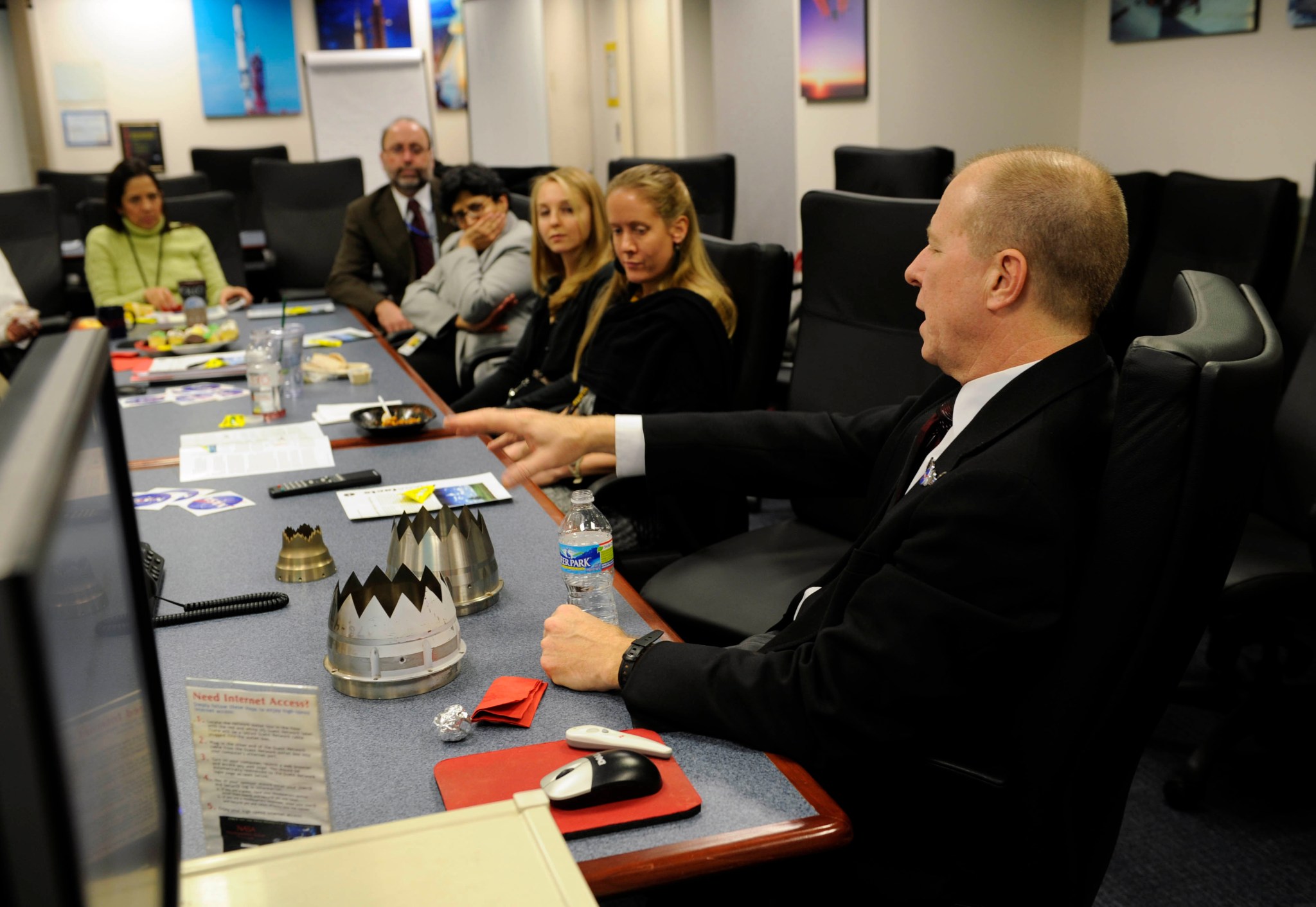 NASA employess having a brown bag lunch to talk about chevron nozzles.