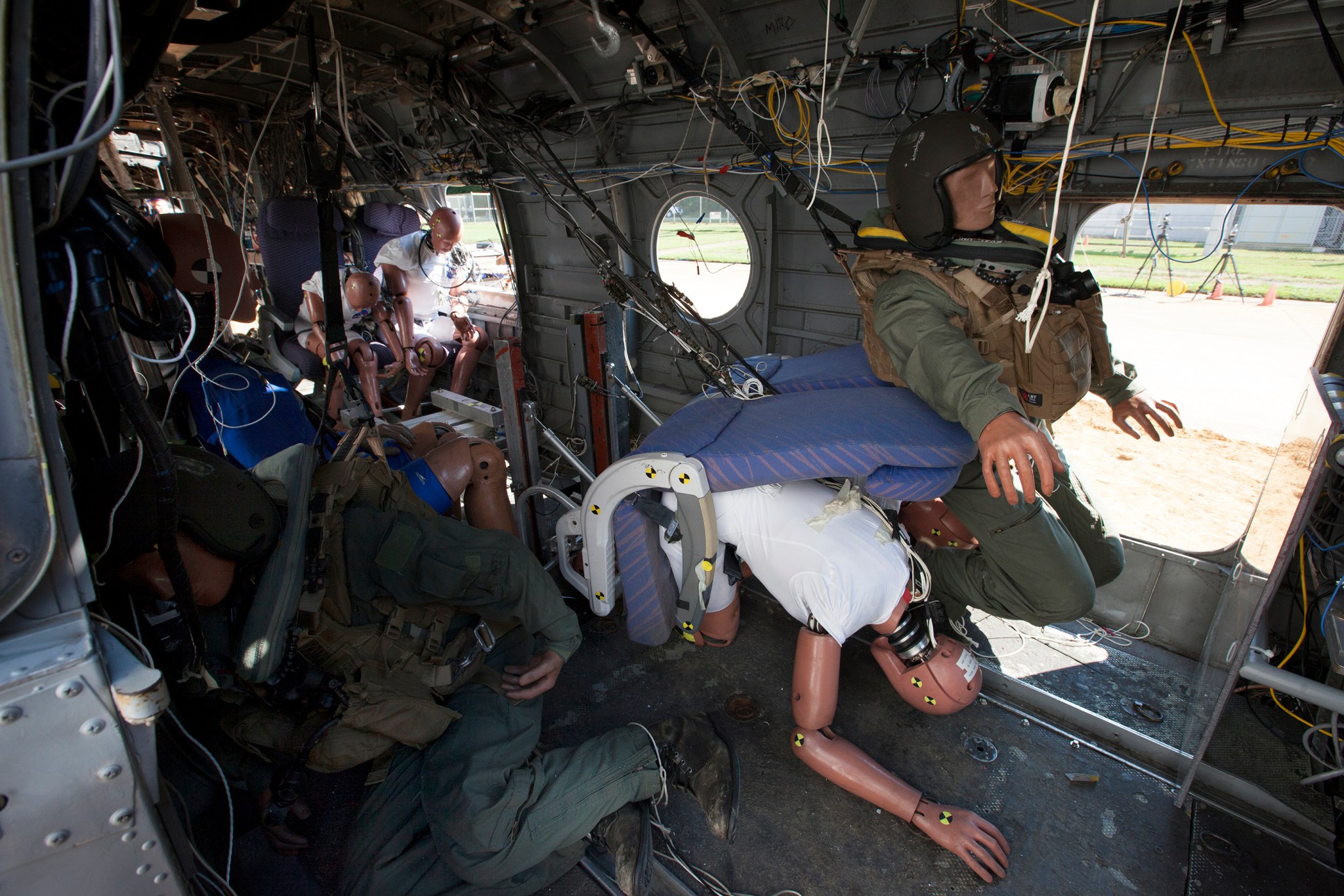 Mannequins placed throughout an airplane.