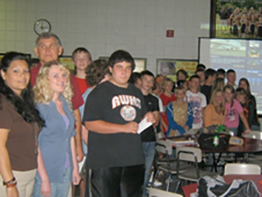 Teacher Zenaida Smith (left) and chat participants from Raceland-Worthington High School.