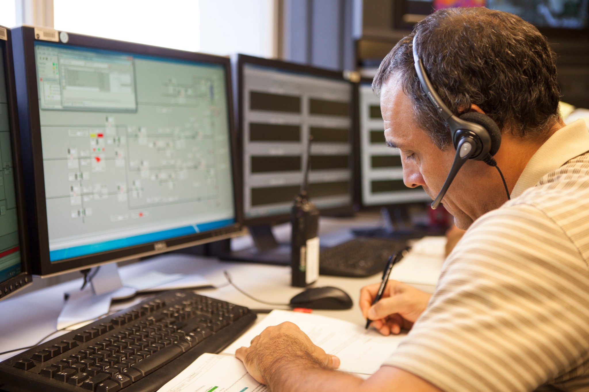 Engineer monitors a test of the Automated Inspection System