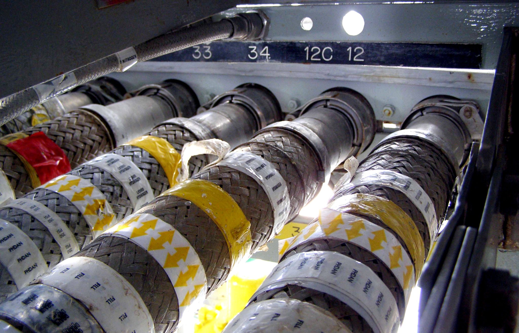 Connectors that feed liquid hydrogen into a spacecraft's fuel cells at Kennedy Space Center's Launch Pad 39A.