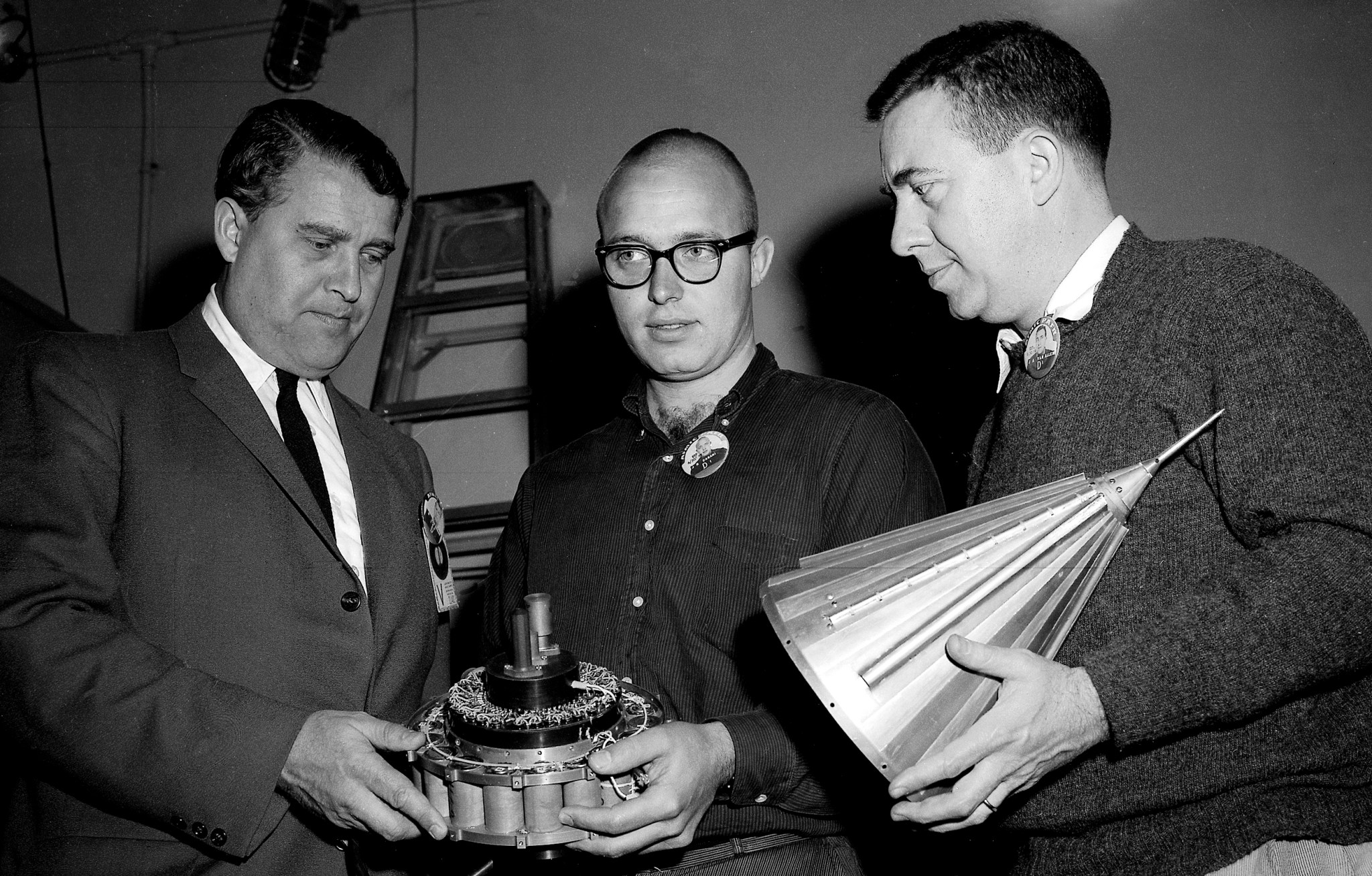 Dr. Wernher von Braun, John Casani, and Dr. James Van Allen inspect components of the Pioneer IV spacecraft on March 1, 1959.