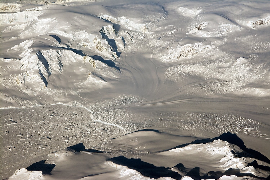 Glaciers and mountains in the evening sun are seen on an Operation IceBridge research flight, returning from West Antarctica on 