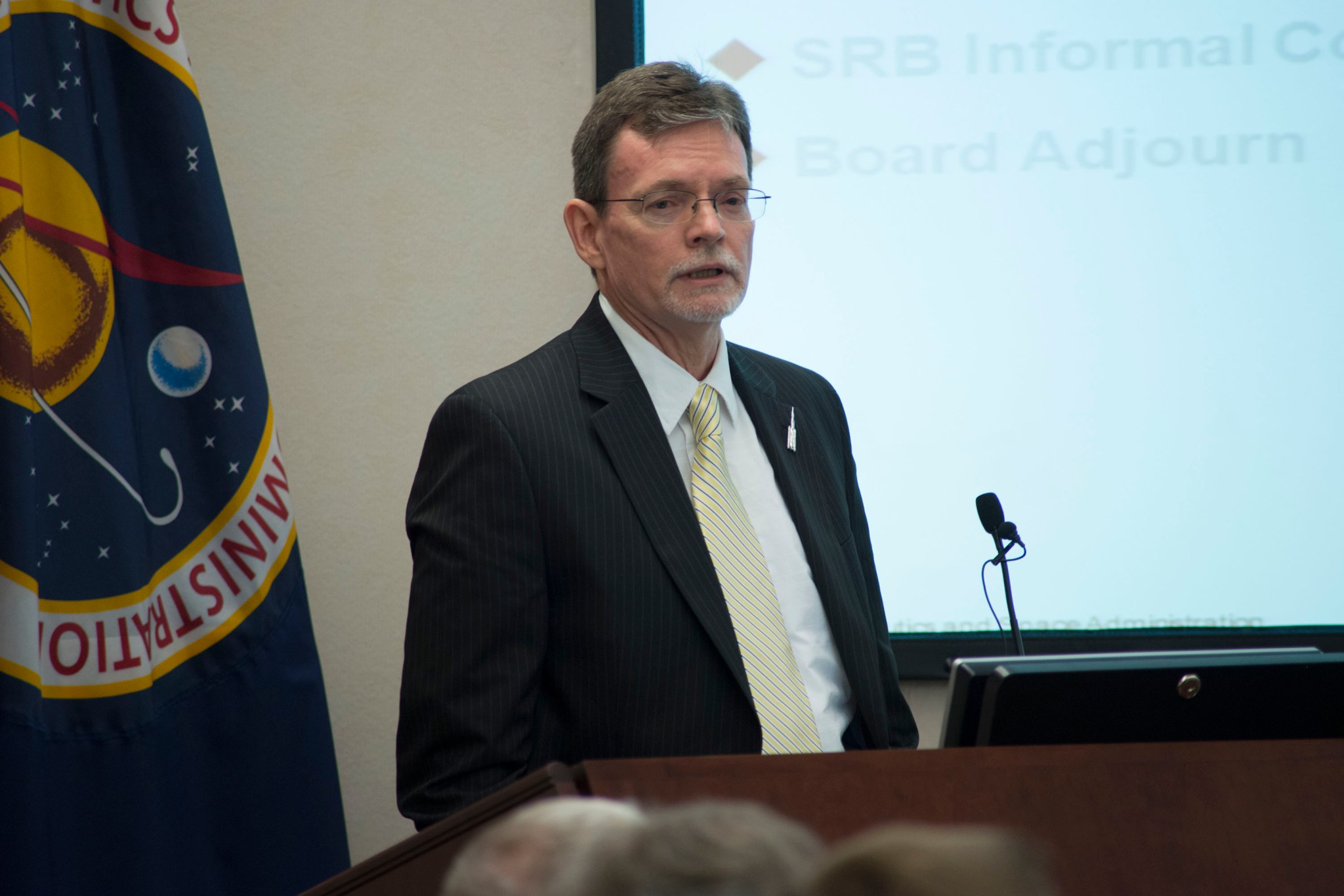 SLS Chief Engineer Garry Lyles presents at the preliminary design review for the new deep space launch vehicle. Lyles is responsible for the overall system design of the SLS.