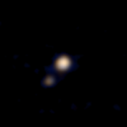 Low resolution image of Pluto and Charon in distance