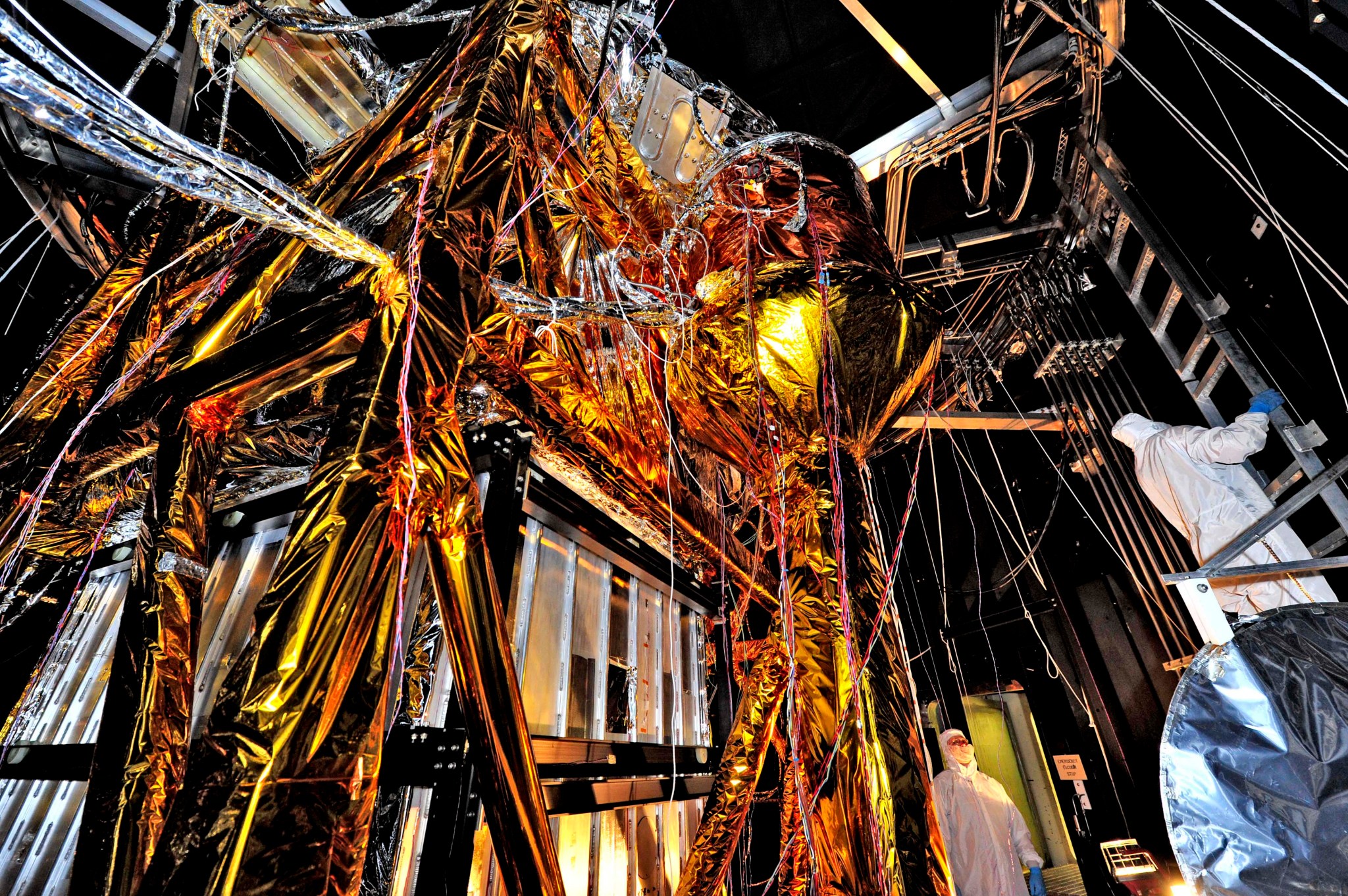 Giant golden web of cables and cords inside large room