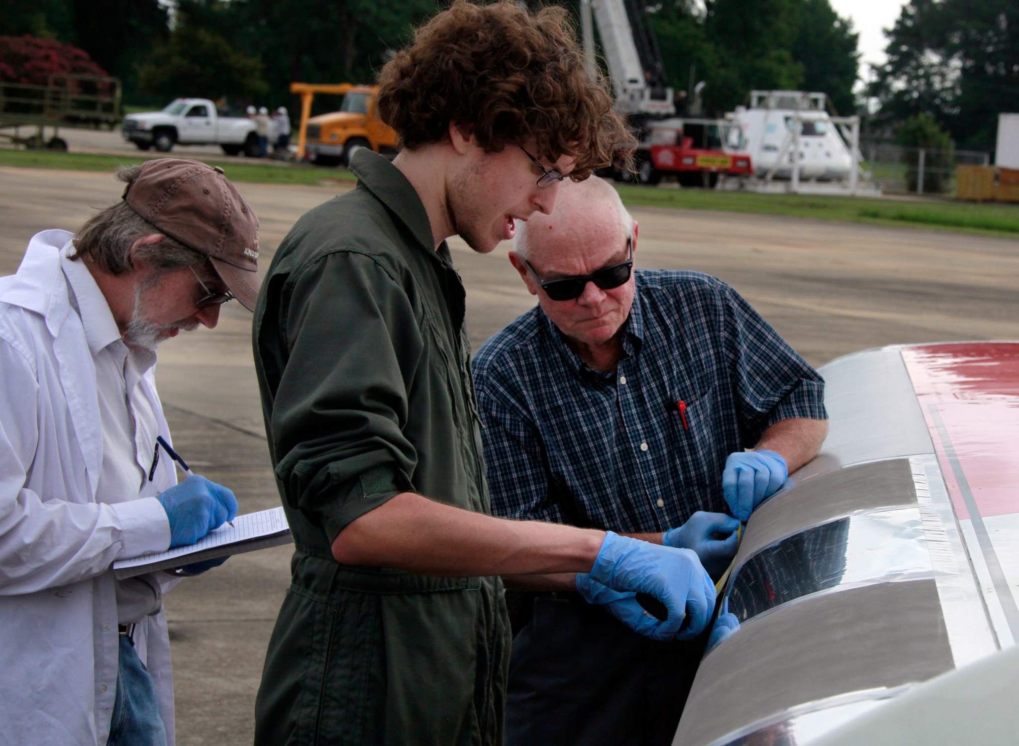 NASA Langley researchers checking results of the nonstick coatings.