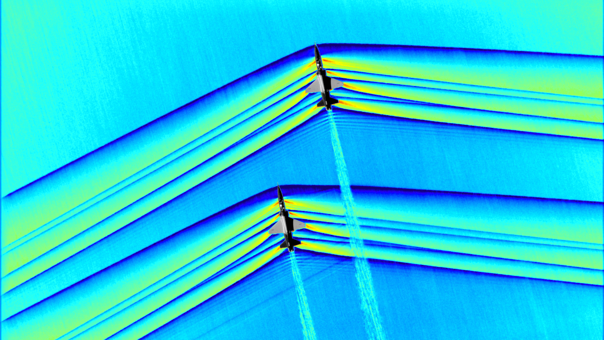 Colorized composite image of a NASA's T-38s in formation flying at supersonic speeds.