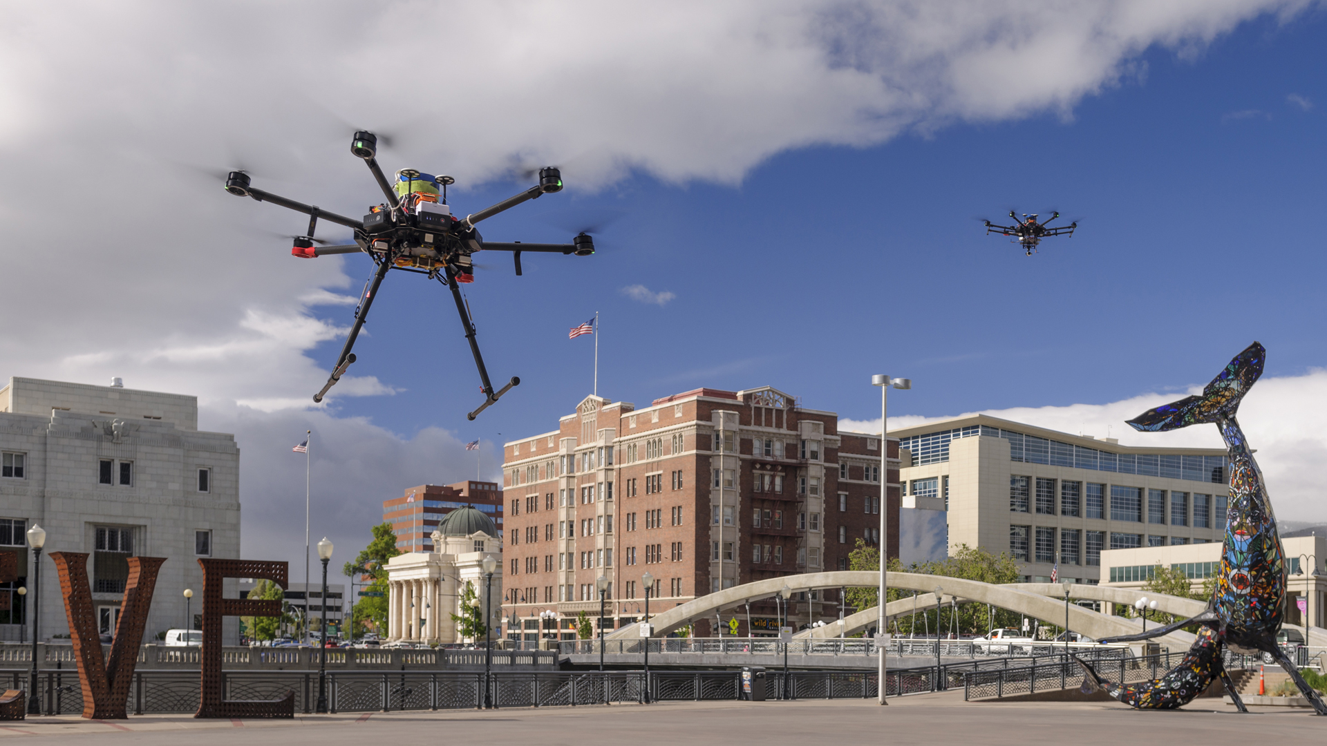 Drones in flight in downtown Reno, Nevada.