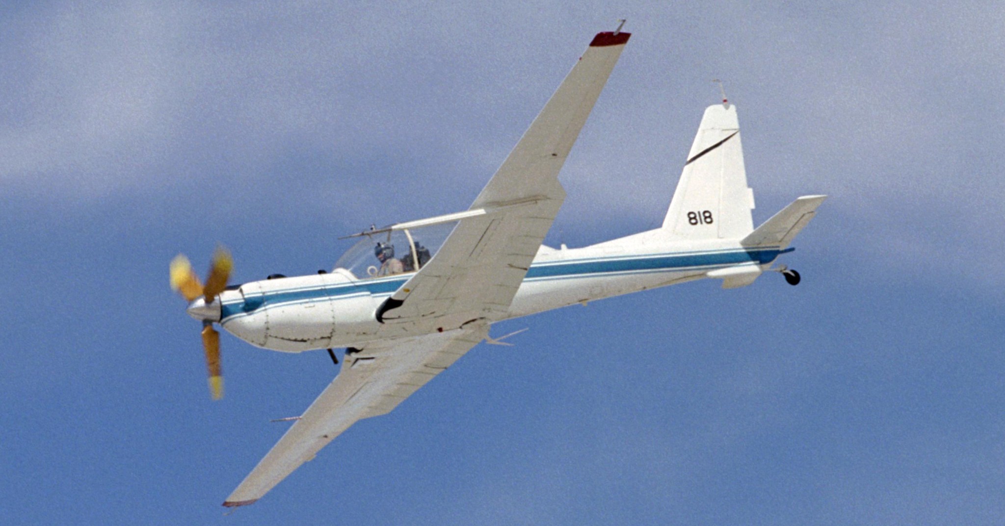 YO-3A with microphones mounted on the tail and wingtips to measure noise.