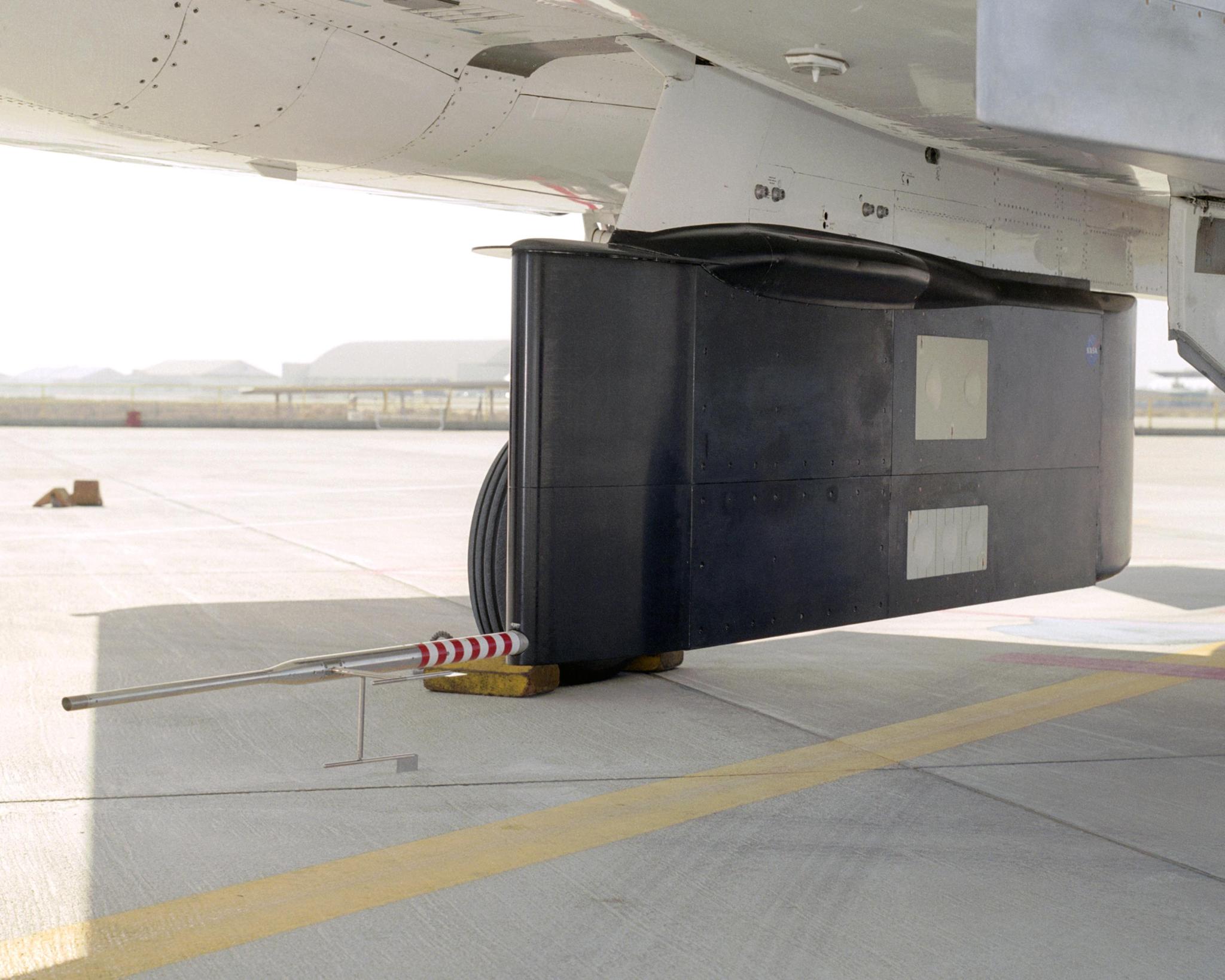 Two panels of Space Shuttle TPS insulation were mounted on the flight test fixture underneath NASA's F-15B