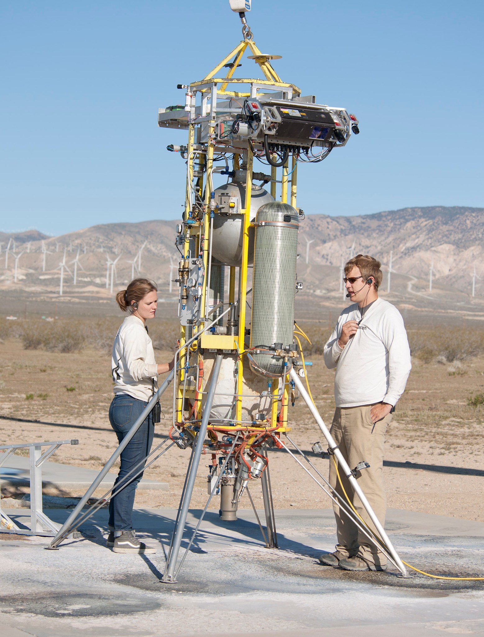 Masten ground crew, interns Ellen Moyer and Wyatt Rehder, prepare Xombie for flight.