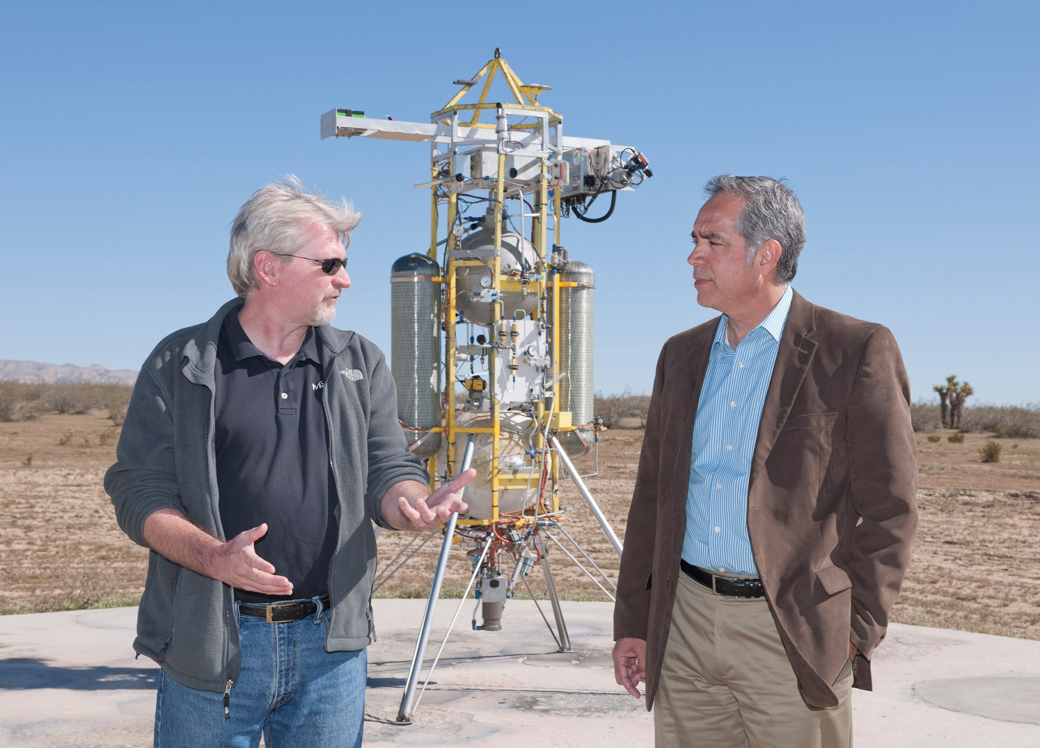 Chief Technology Officer David Masten discusses rocket flight with Armstrong Flight Research Center Director David McBride.