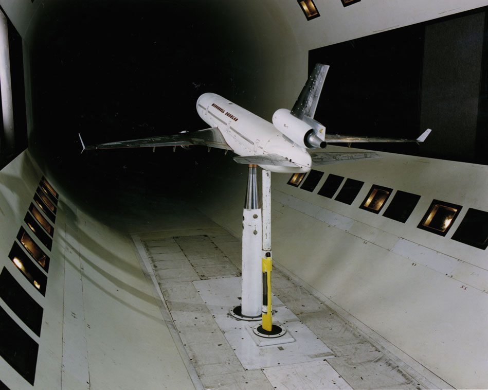 A model airplane inside of a wind tunnel