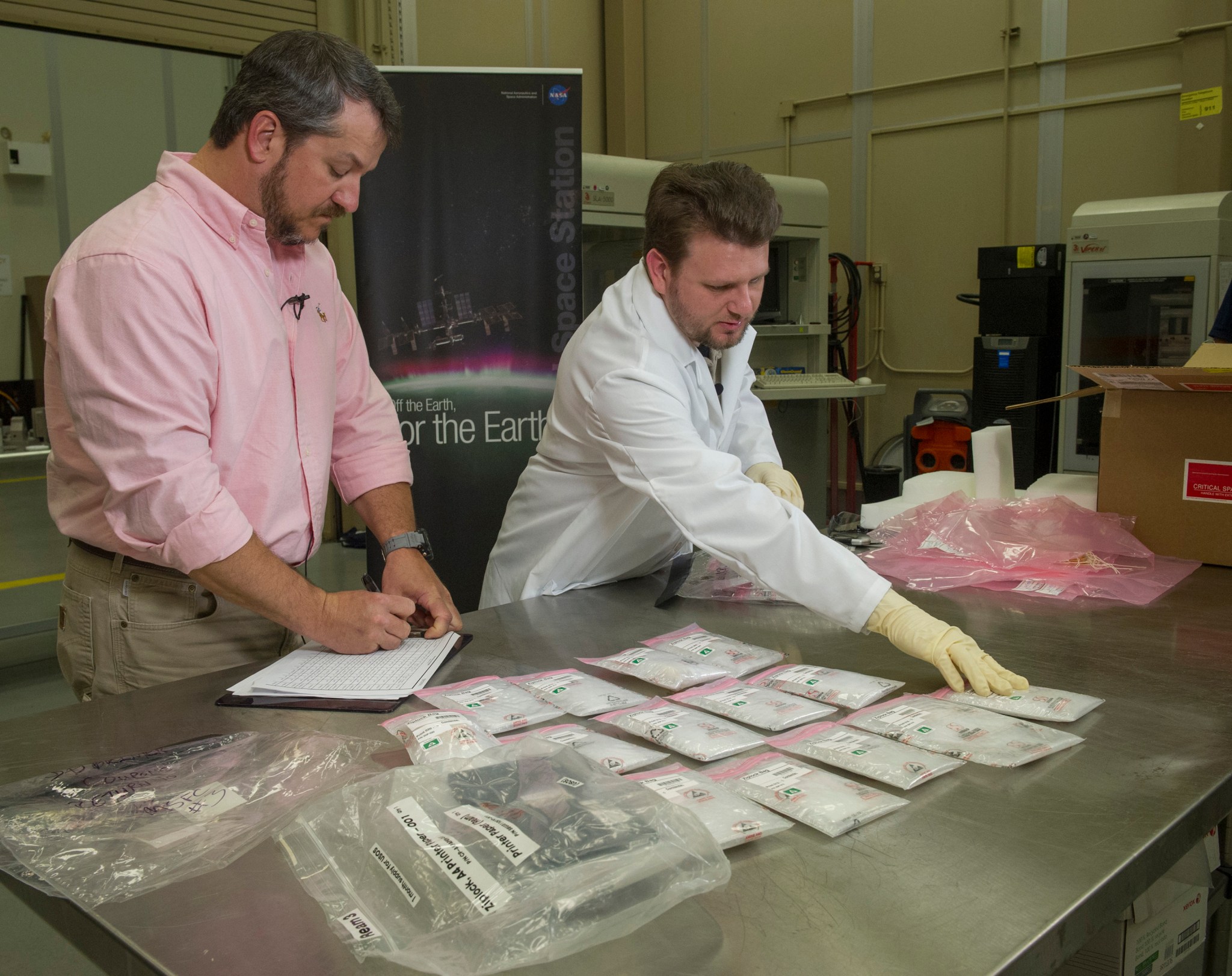 The first items ever manufactured in space with a 3-D printer where unboxed on April 6, 2015 in the Additive Manufacturing Labor