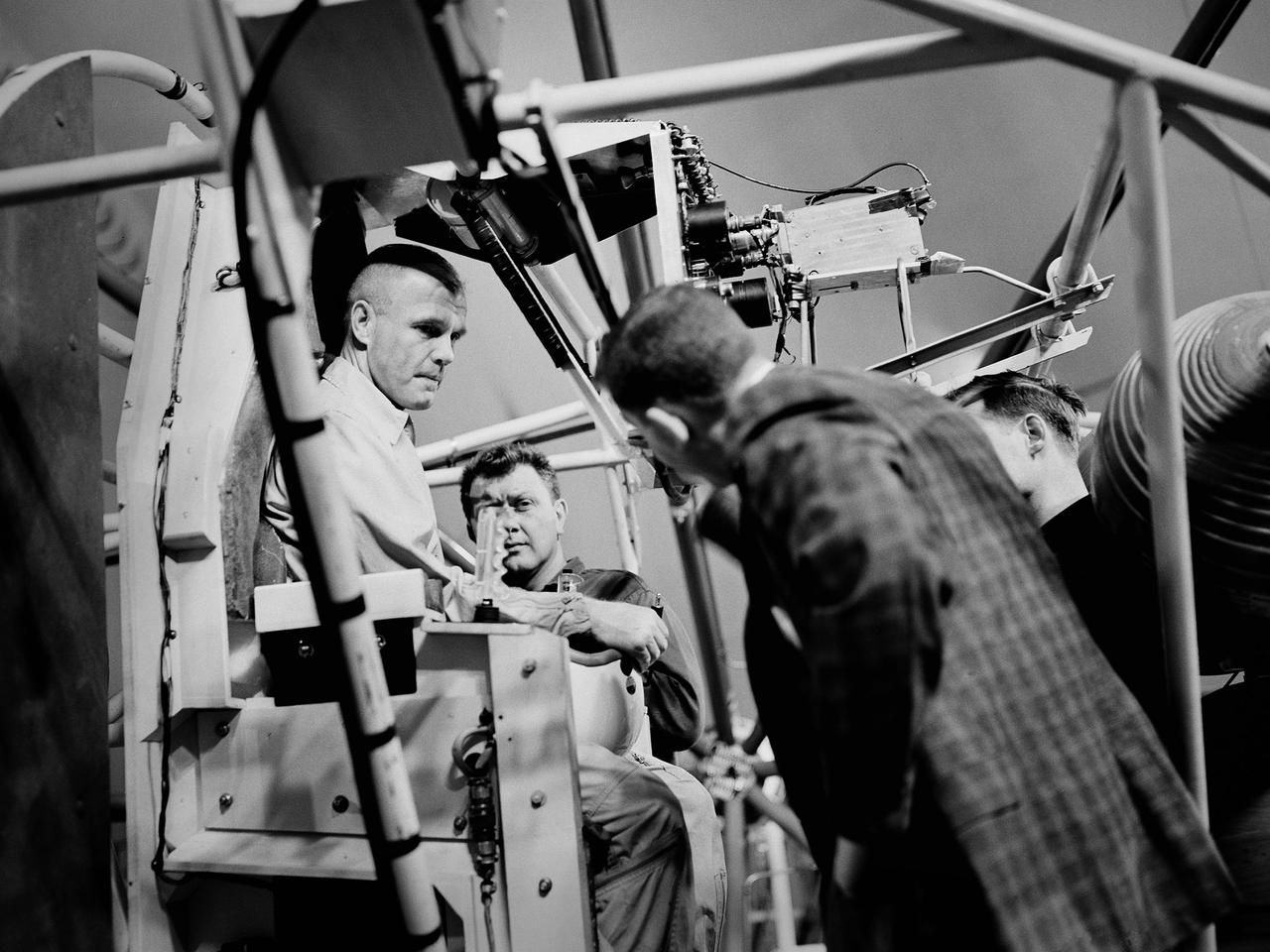 Mercury astronaut John Glenn prepares for a test in the Multi-Axis Space Test Inertia Facility (MASTIF) inside the Altitude Wind Tunnel at the National Aeronautics and Space Administration (NASA) Lewis Research Center.