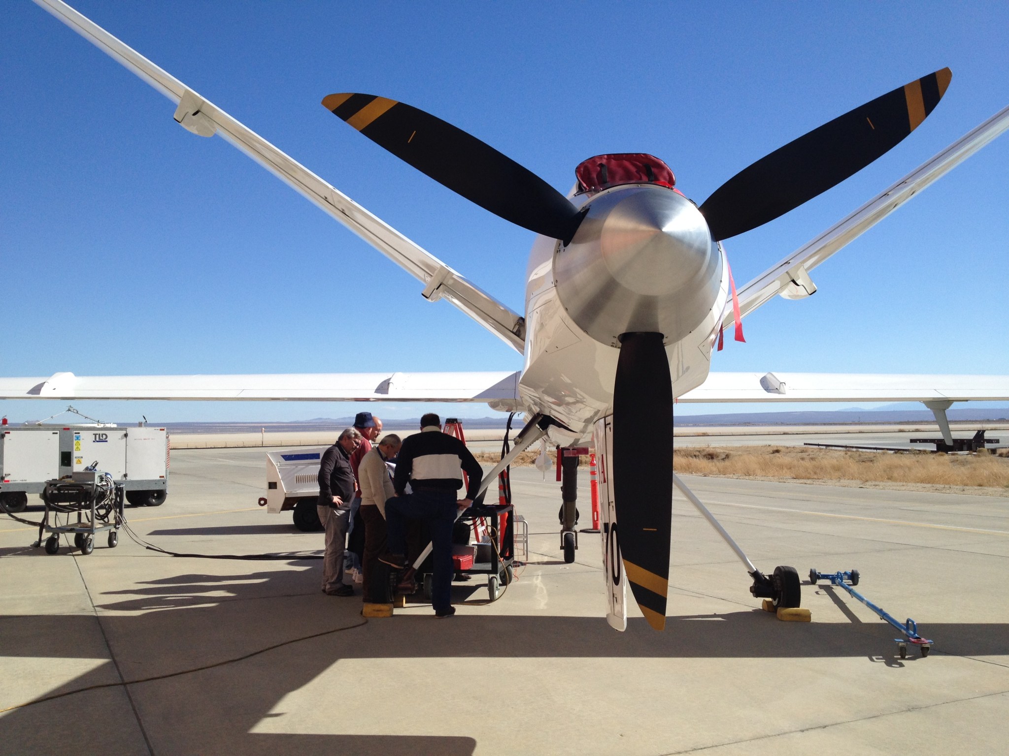 Engineers and technicians check the ADS-B equipment following its installation on NASA Dryden's Ikhana (Predator B) unmanned air