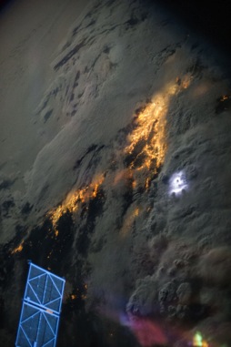 Image from orbit of lightning strikes through clouds