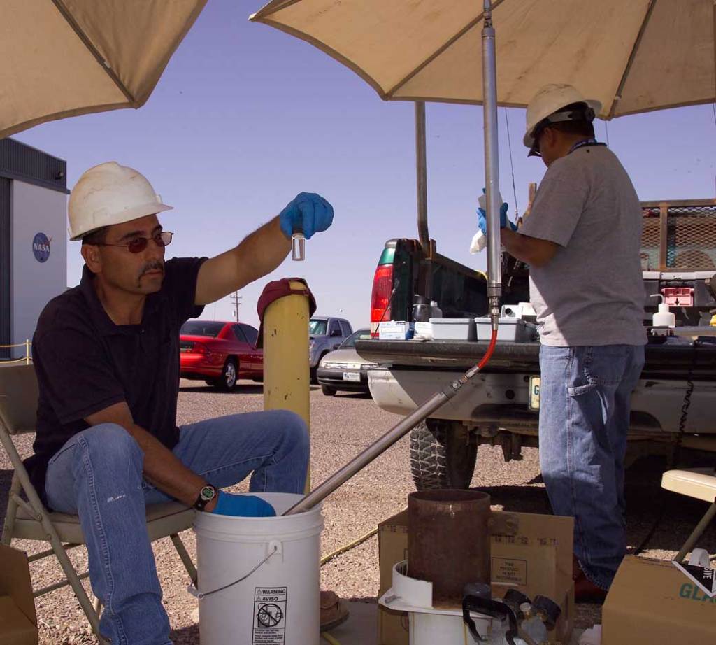 Technicians test water samples