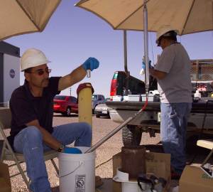 Technicians test water samples