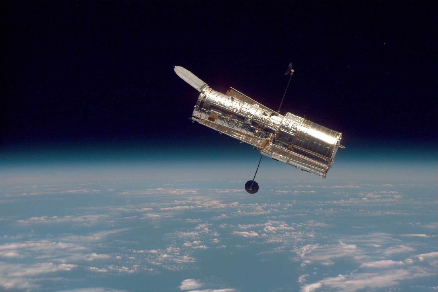 The Hubble Space Telescope in orbit above Earth.