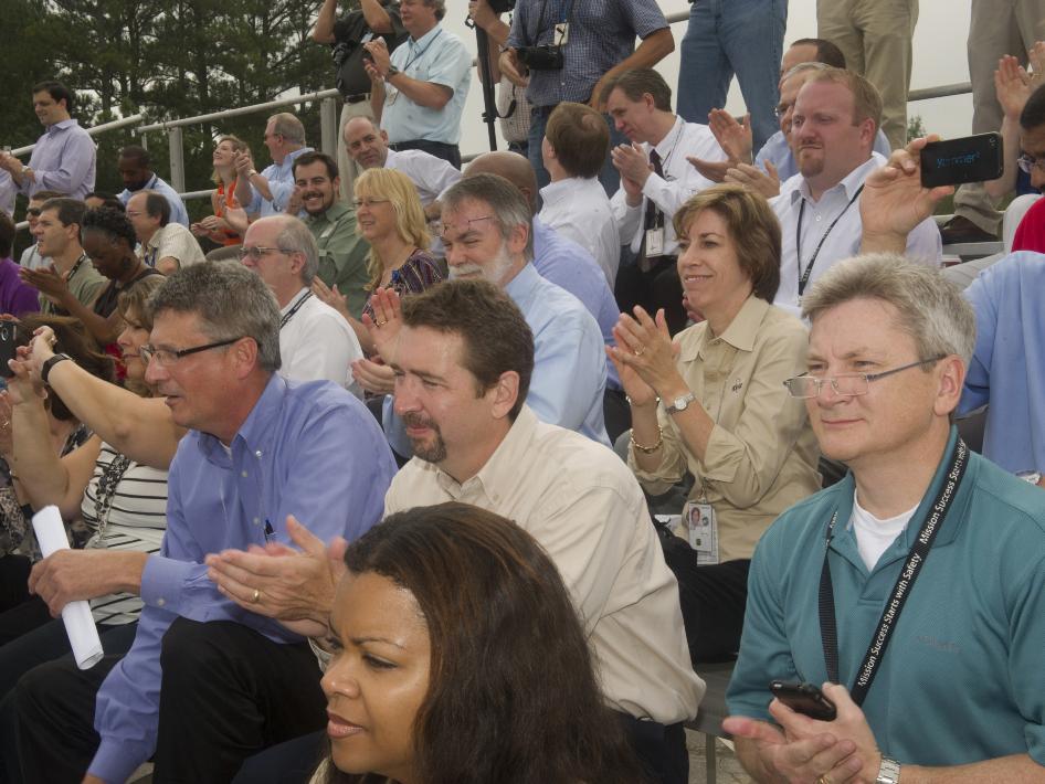 An excited crowd claps and cheers as the "Mighty Eagle" lands after a successful, 100-foot test.