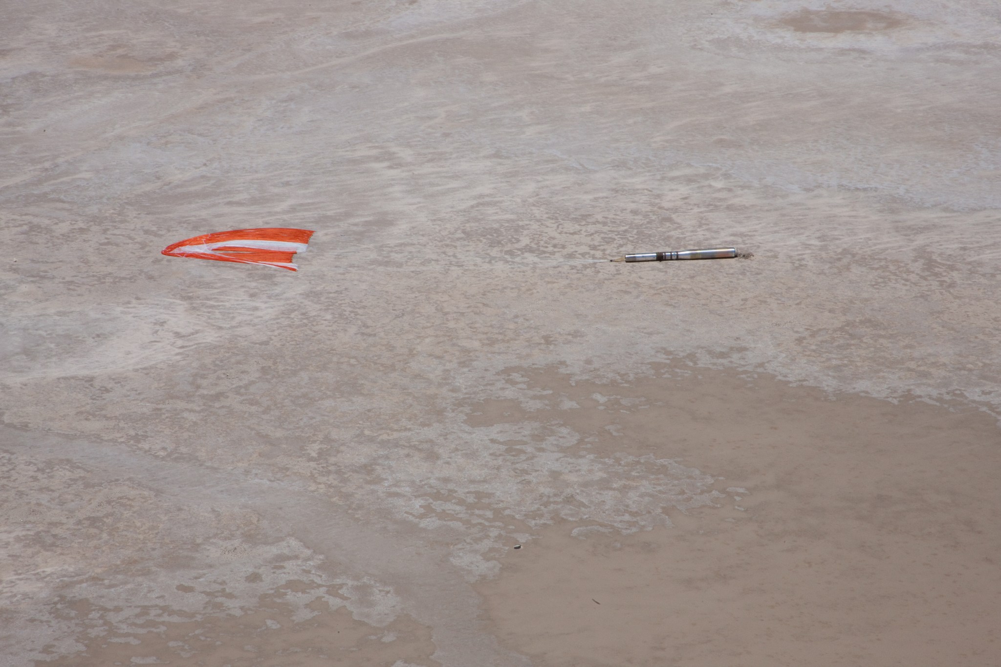 The Hi C payload and the subsystems rest on the desert after parachuting back to Earth.