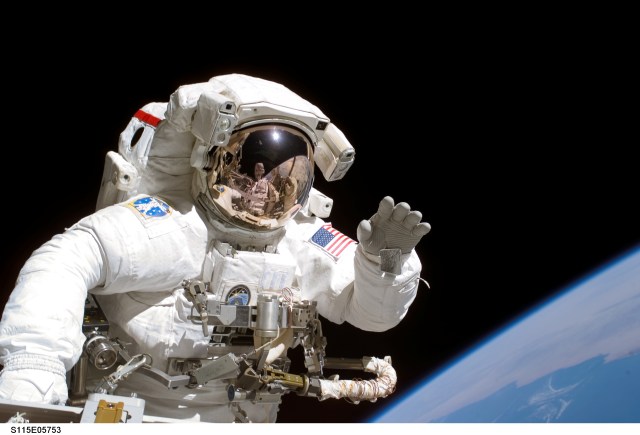 Astronaut floating in space with Earth in background