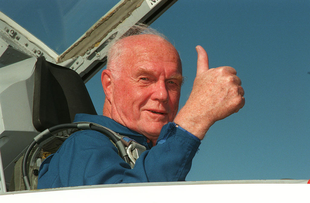 STS-95 Payload Specialist John H. Glenn Jr., senator from Ohio, gives a thumbs up on his arrival at Kennedy Space Center's Shuttle Landing Facility aboard a T-38 jet. 