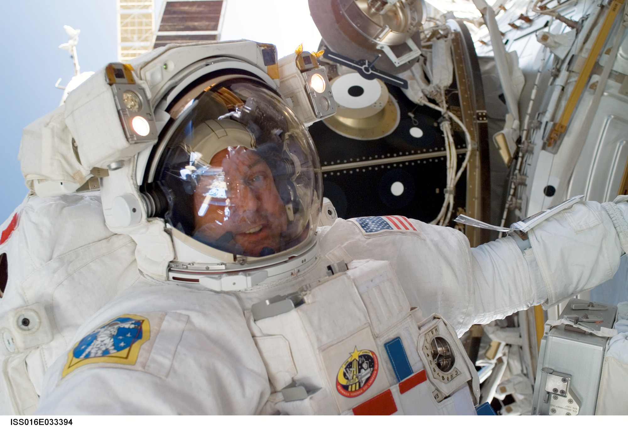 Astronaut Mike Foreman works outside the station during the fourth spacewalk of STS-123.
