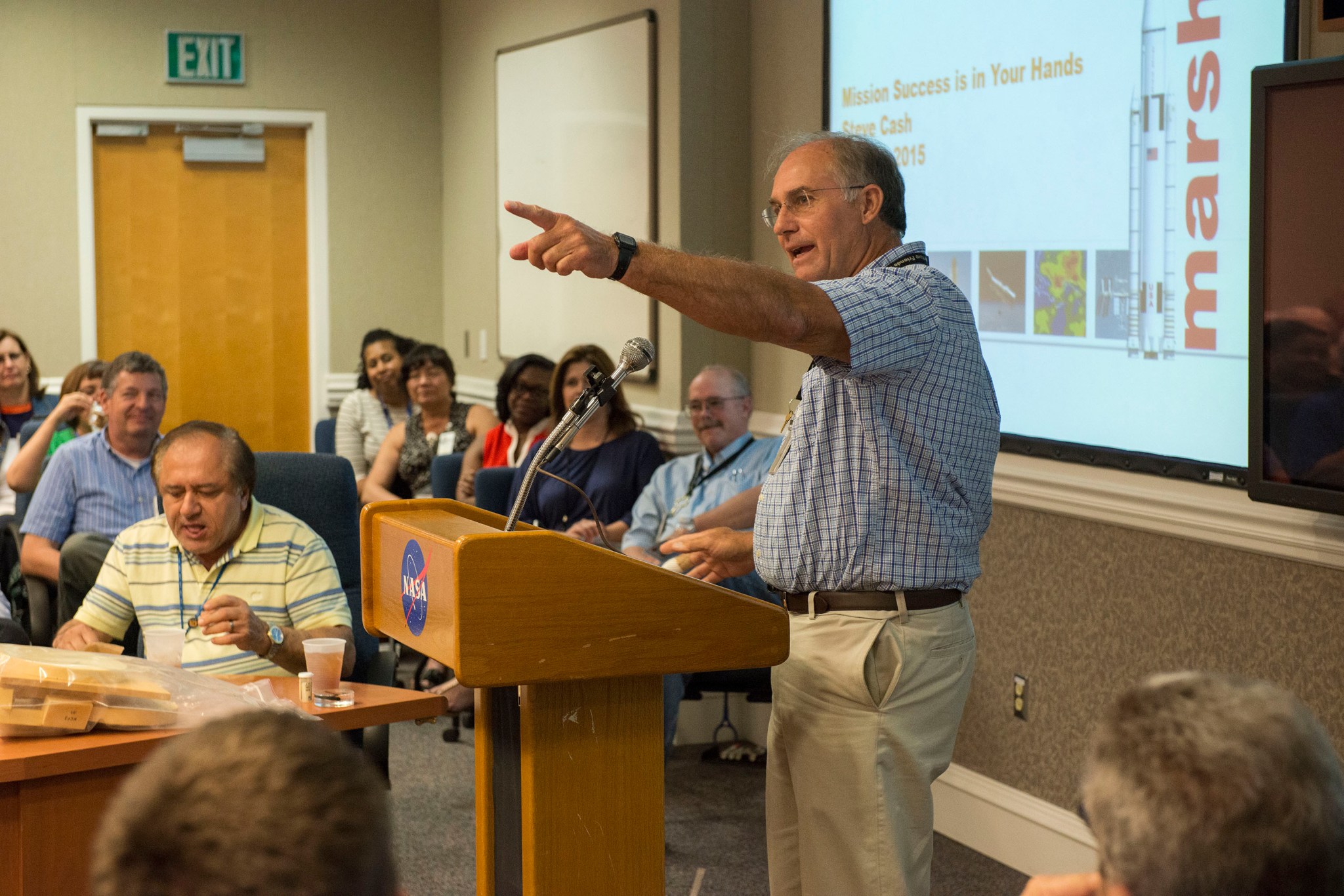 Steve Cash addresses a full house during a Shared Experiences forum held May 14 in Building 4203. 