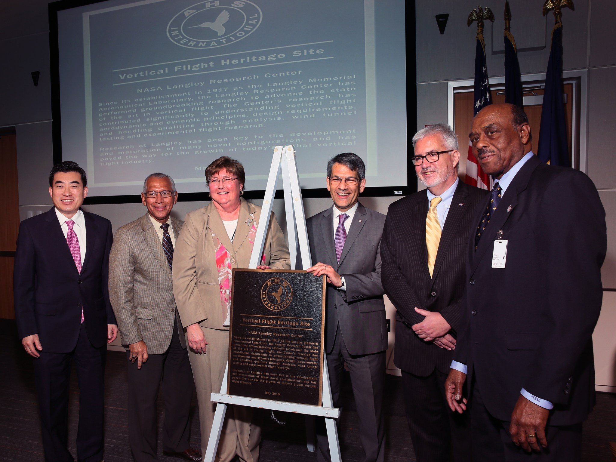 Leaders pose with AHS International Vertical Flight Heritage Site.