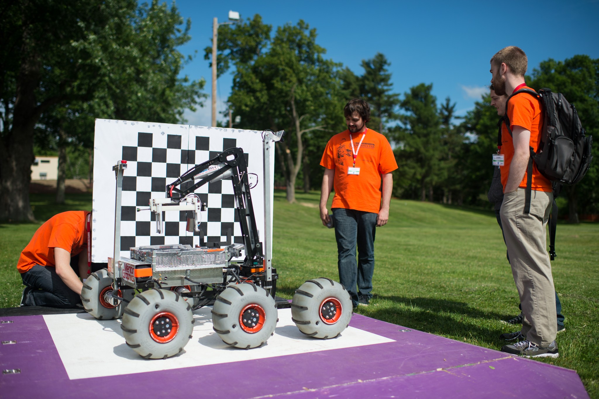 Members of the Oregon State University Mars Rover Team prepare their robot for the 2014 Sample Return Robot competition. 