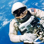 Astronaut Ed White floats in the microgravity of space outside the Gemini IV spacecraft.