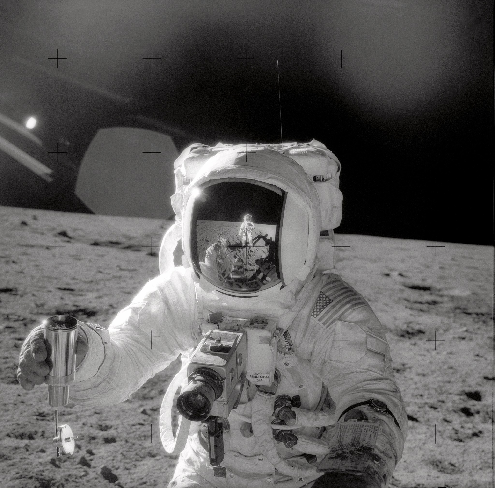 Apollo astronaut taking a sample of the lunar surface