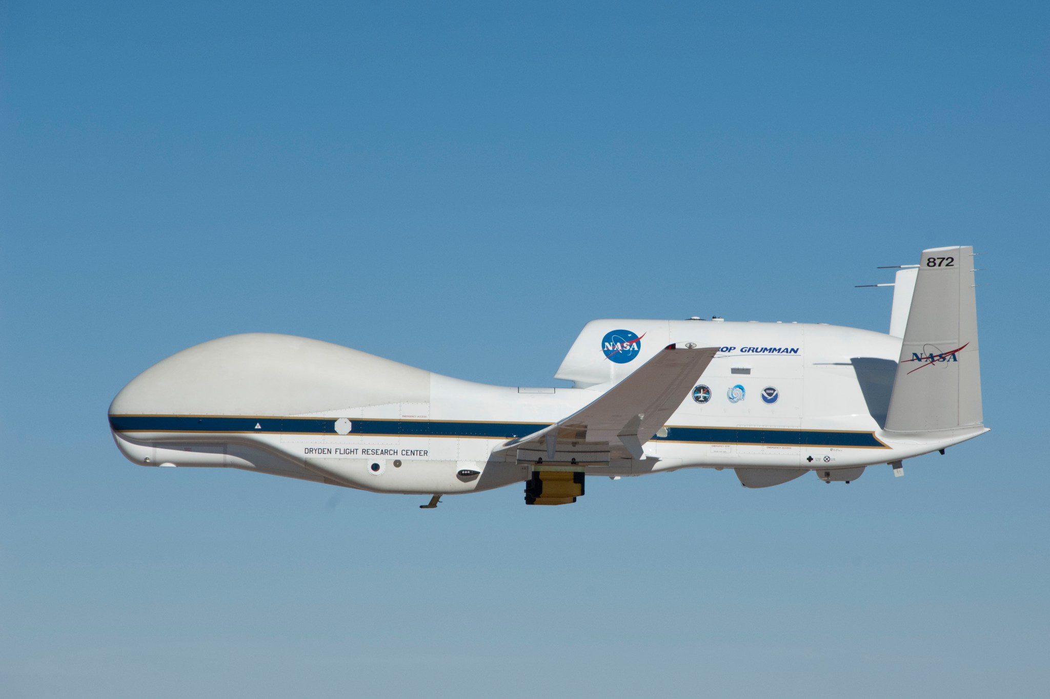 The two yellow-and-black pods under the wings of NASA Global Hawk No. 872 house atmospheric measurement probes.