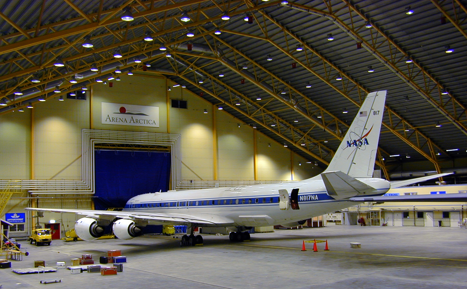 A large airplane inside a building