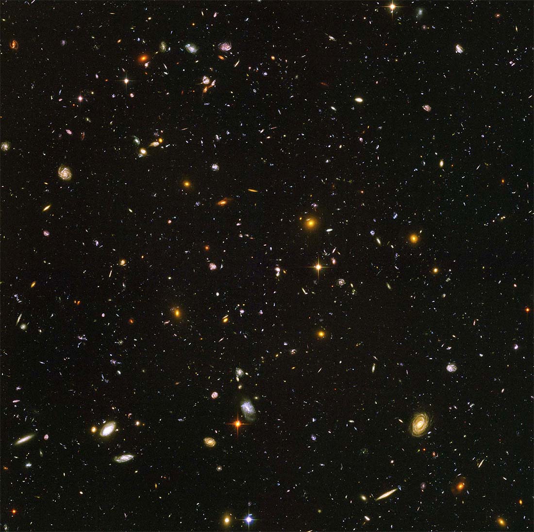 Hundreds of different colored galaxies in space