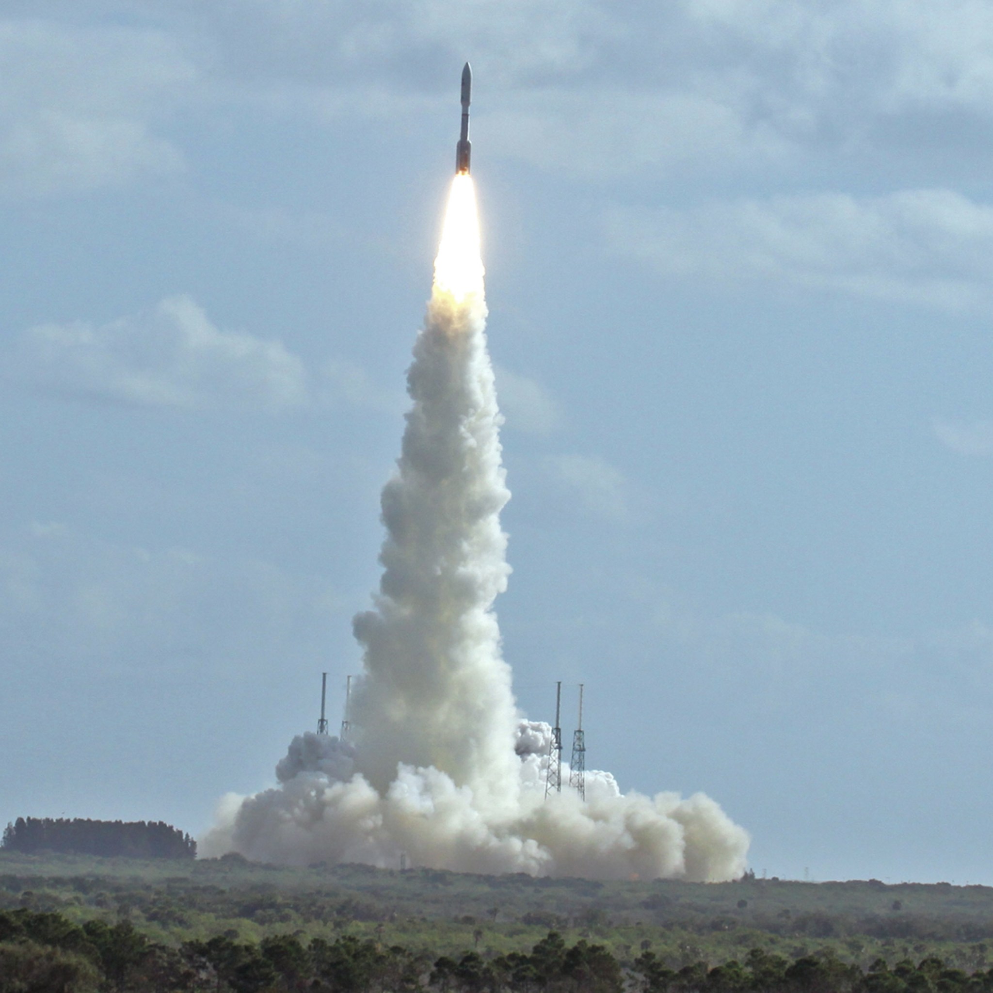 A launching rocket leaves a tall column of smoke beneath