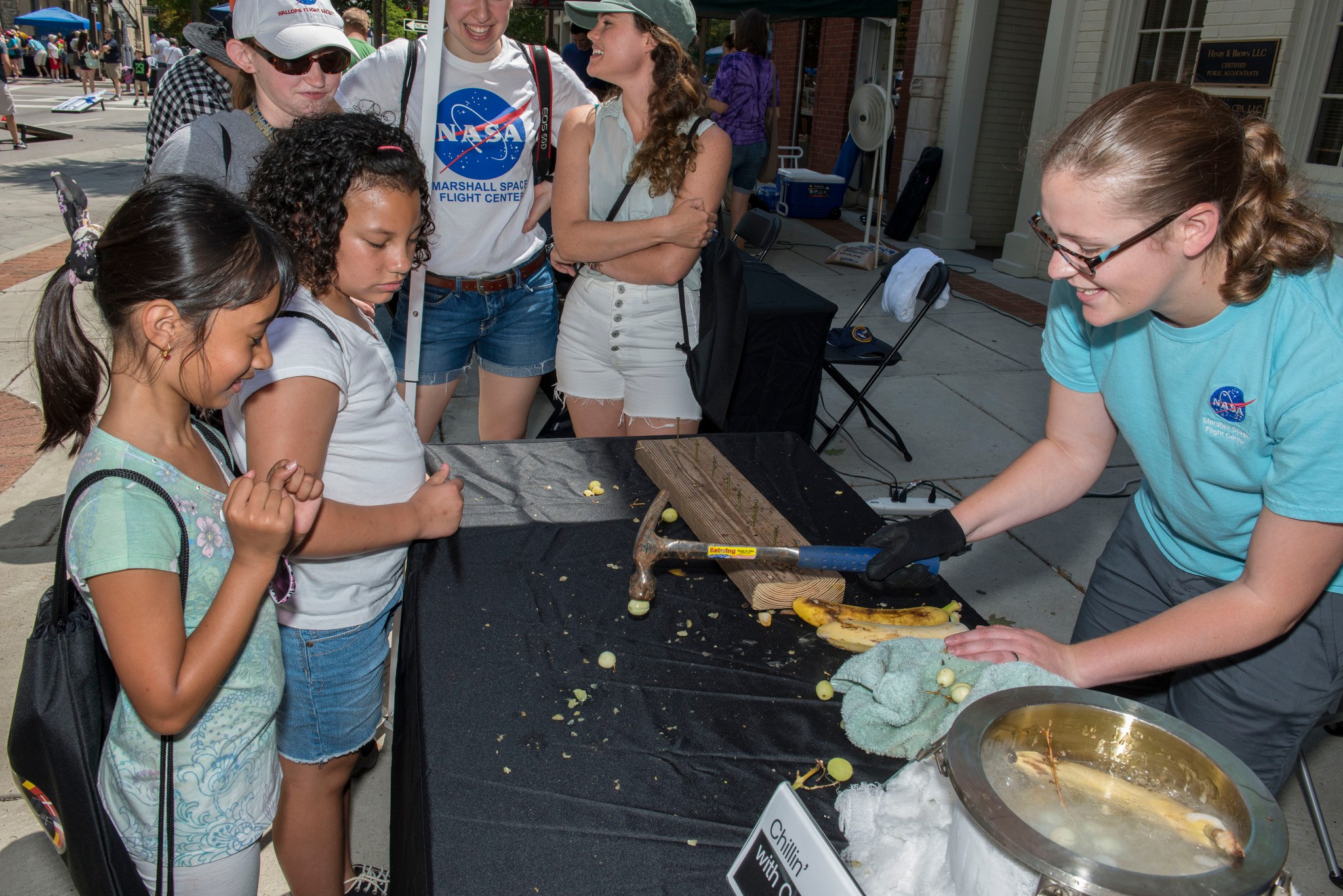 With bananas and grapes, kids get a cool lesson about cryogenics on a warm day at NASA on the Square. 