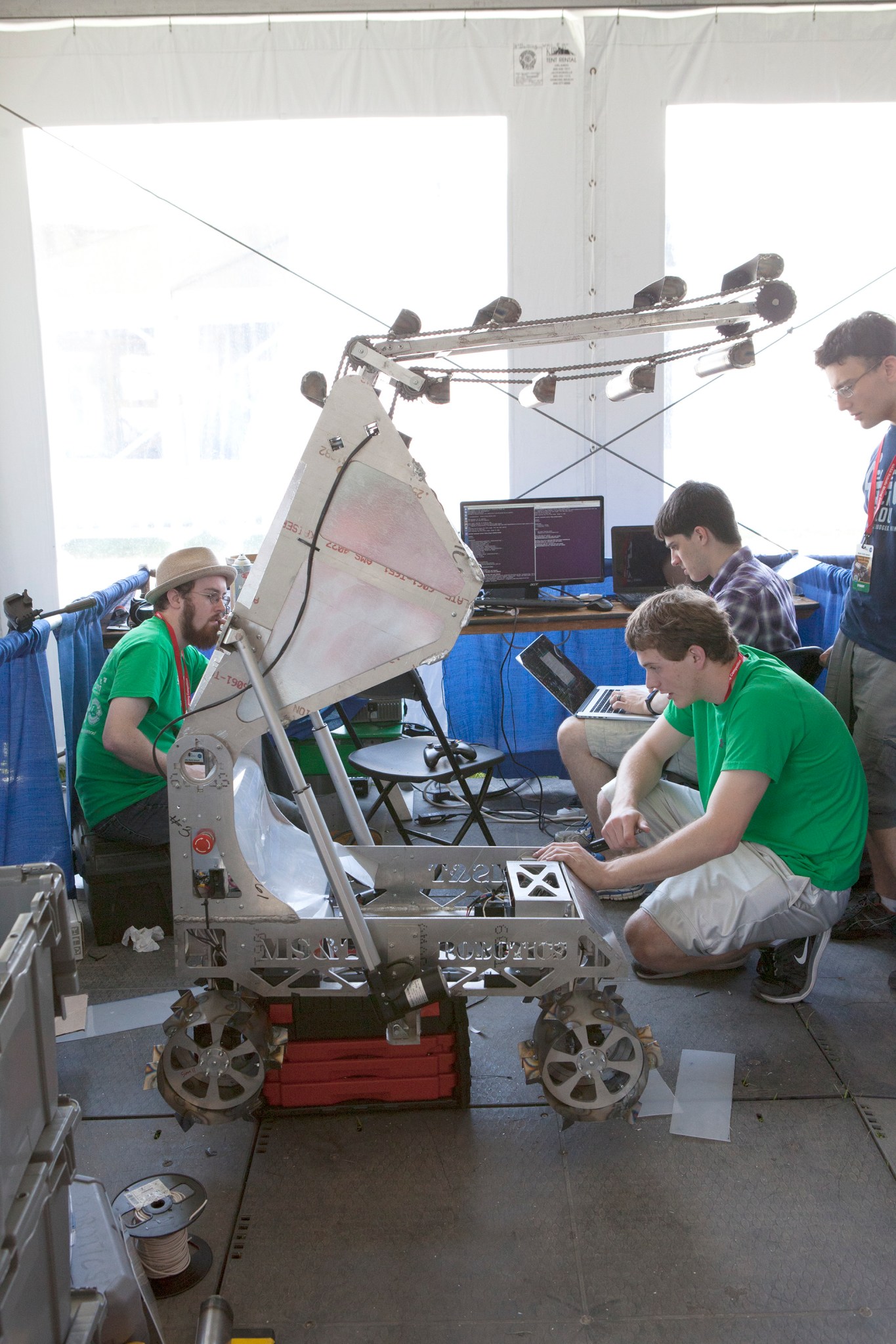 Team members prepare their robot miner for competition.